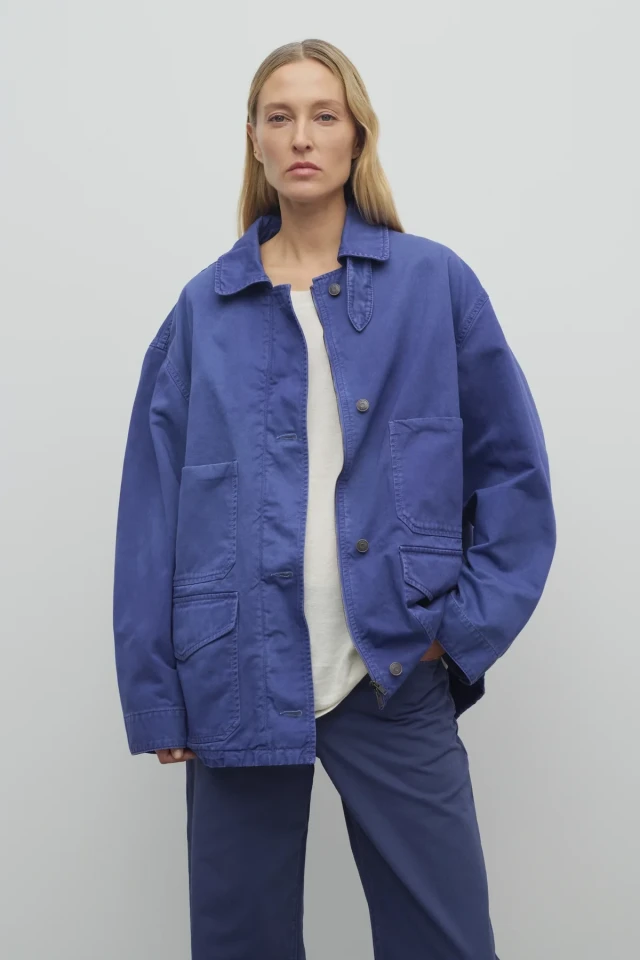 Woman in blue work jacket