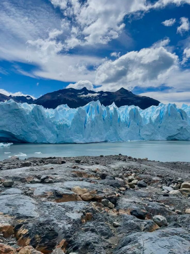 Glacier, mountains, blue ice, rocks.