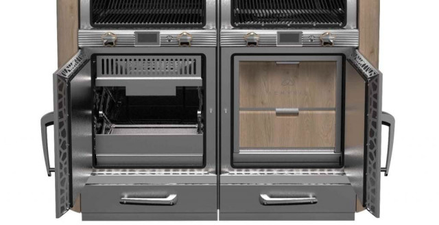 Dual charcoal ovens with open doors revealing compartments, situated in a commercial kitchen setting