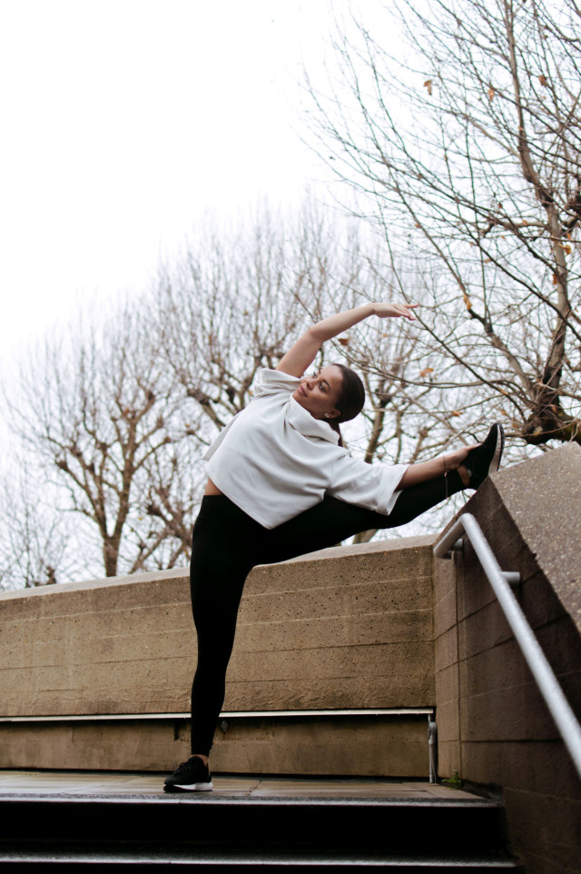 Woman stretching outdoors.