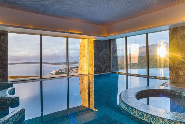 Indoor pool with mountain view.