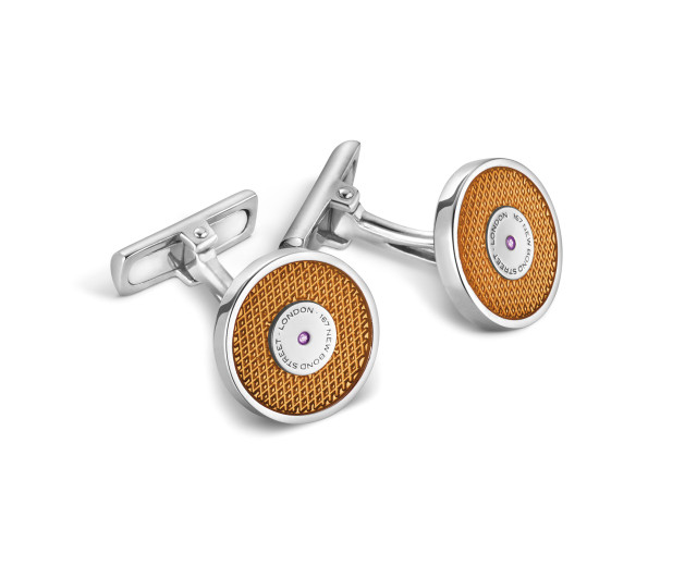 Cufflinks with amber faces and gemstone.