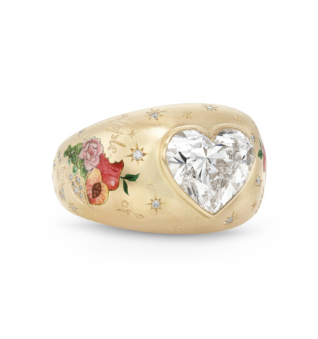 Gold ring with heart diamond and flower band.