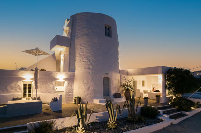 Whitewashed villa at sunset.
