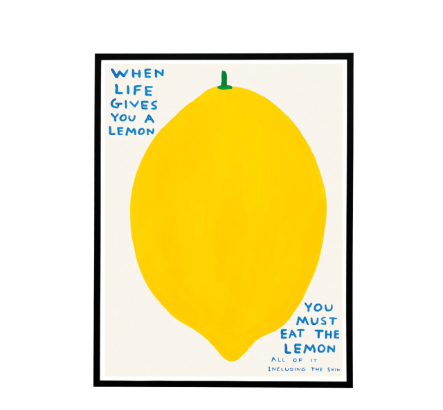 Framed lemon print with humorous text.