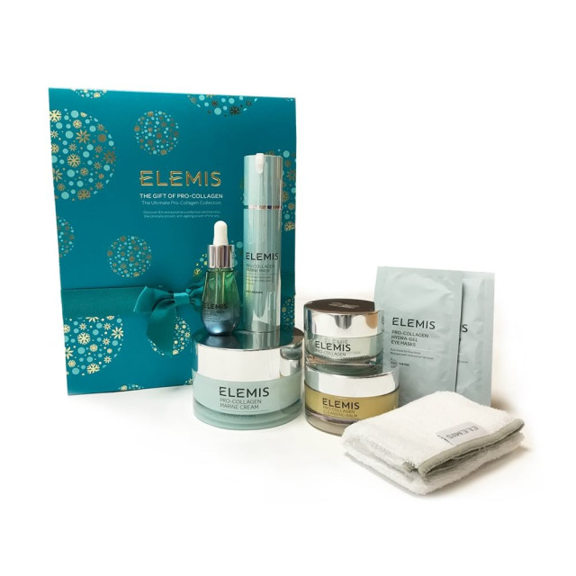 Elemis skincare set with creams, serums, and masks in a teal box.