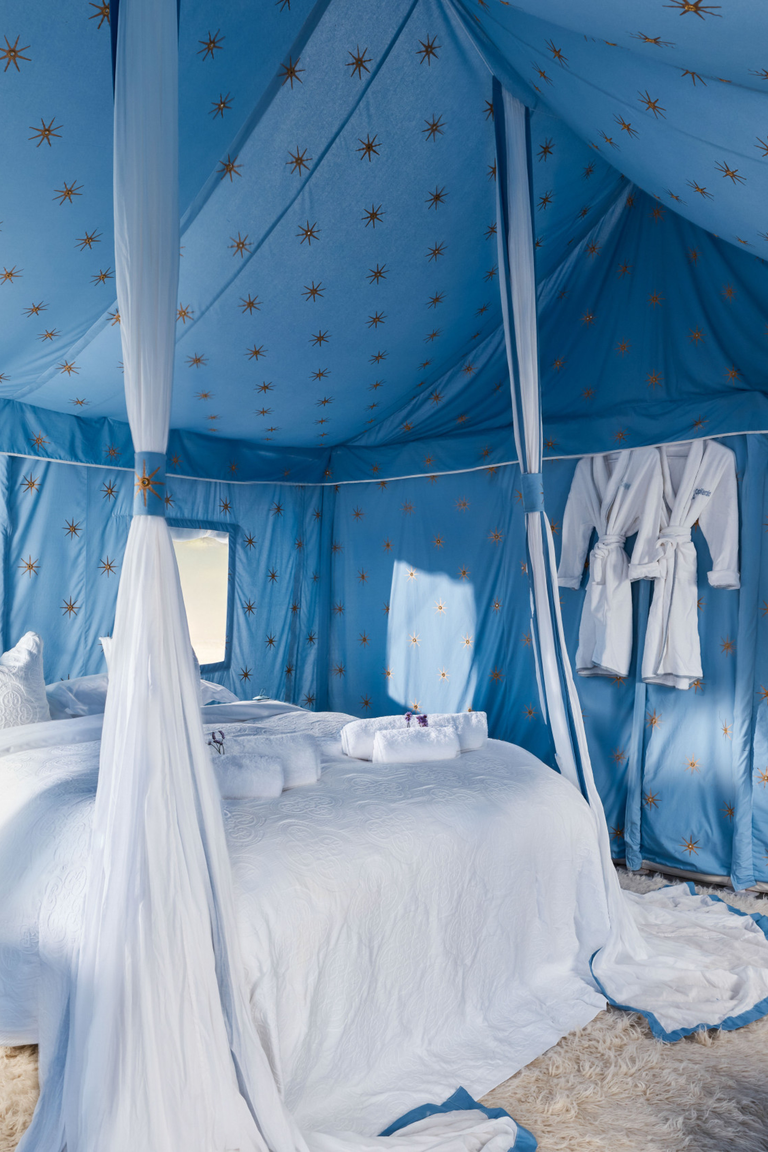 Starry blue glamping tent bedroom.