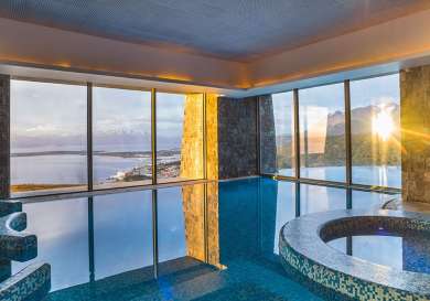 Indoor pool with mountain view.