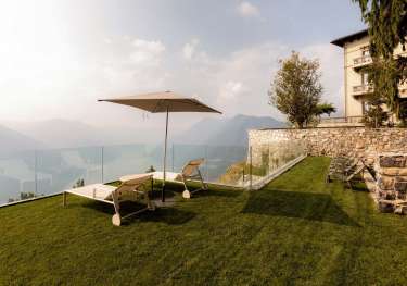 Mountaintop lawn chairs and umbrella.