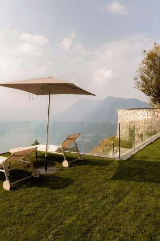 Mountaintop lawn chairs and umbrella.