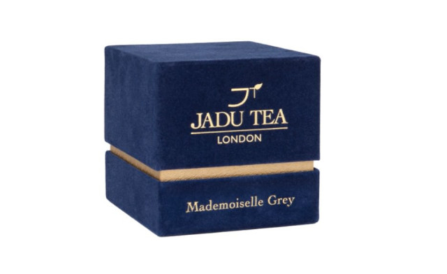 Dark-blue velvet tea box labeled 