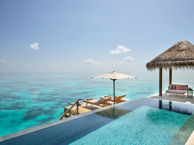 Infinity pool over water villa 