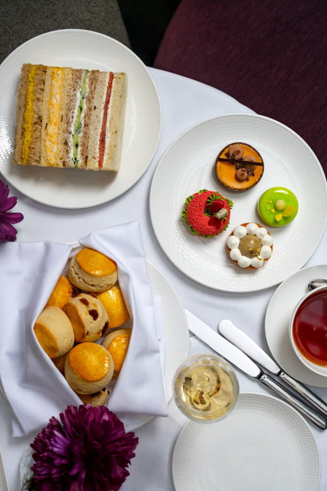 aerial view of afternoon tea placed on white tablecloth 