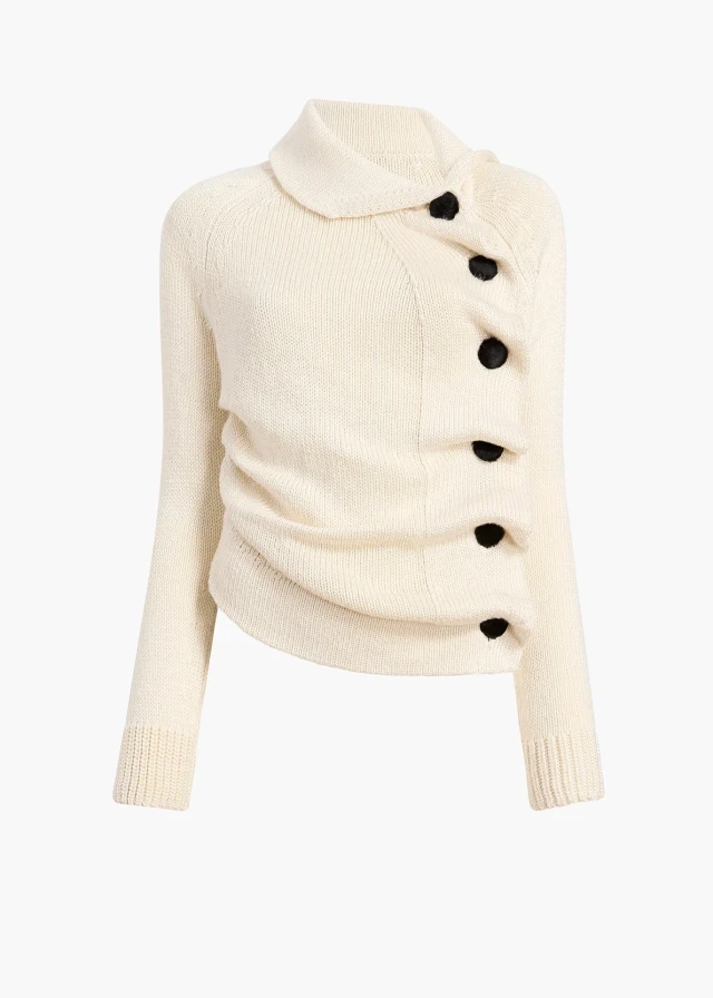 Cream buttoned knit cardigan.