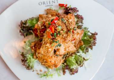 Fried chicken with garlic and chili on lettuce with 