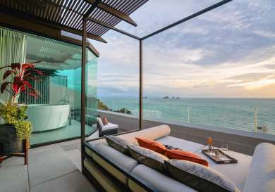 Hotel terrace with views of ocean.