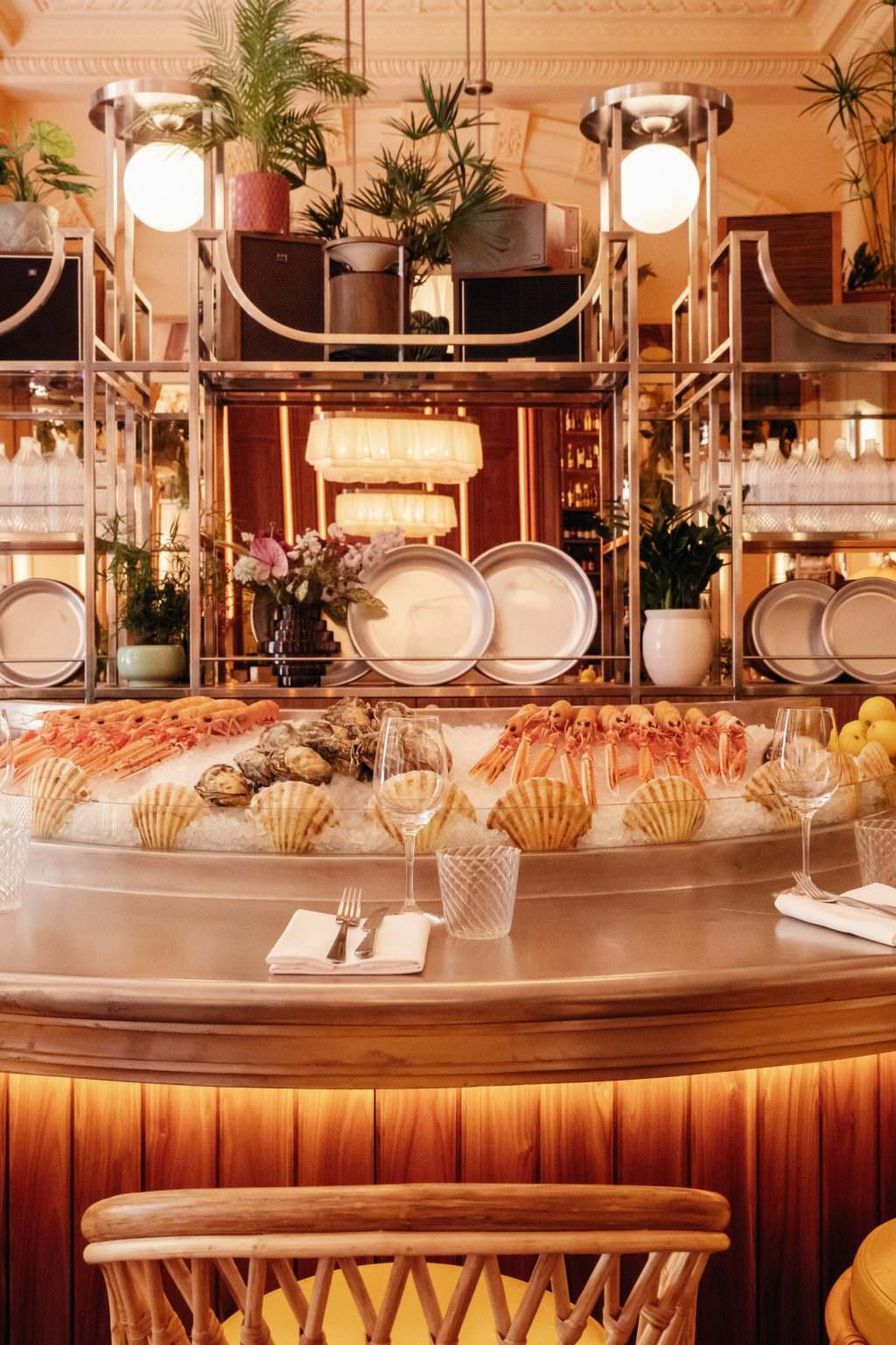 Upscale oyster bar with seafood on ice.