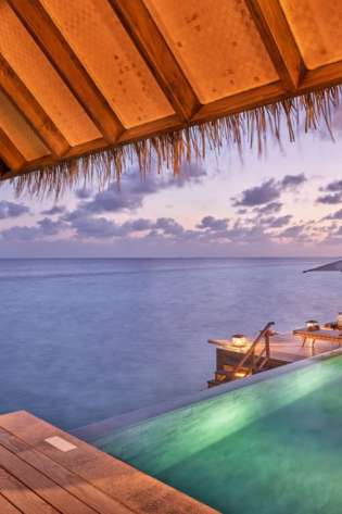 Esin gural argat, the female entrepreneur behind joali maldives outside pool.