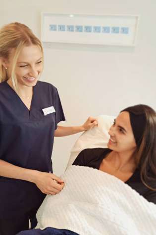 Vicky dondos with a patient.