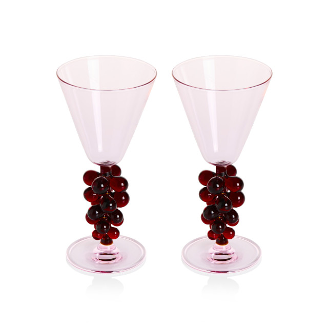 Pink glasses with grape stems.
