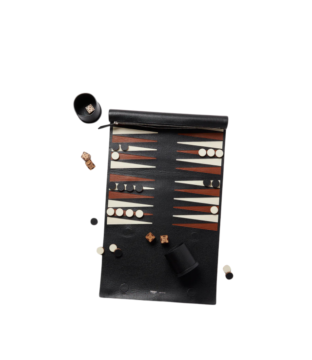 Backgammon game on black leather board.