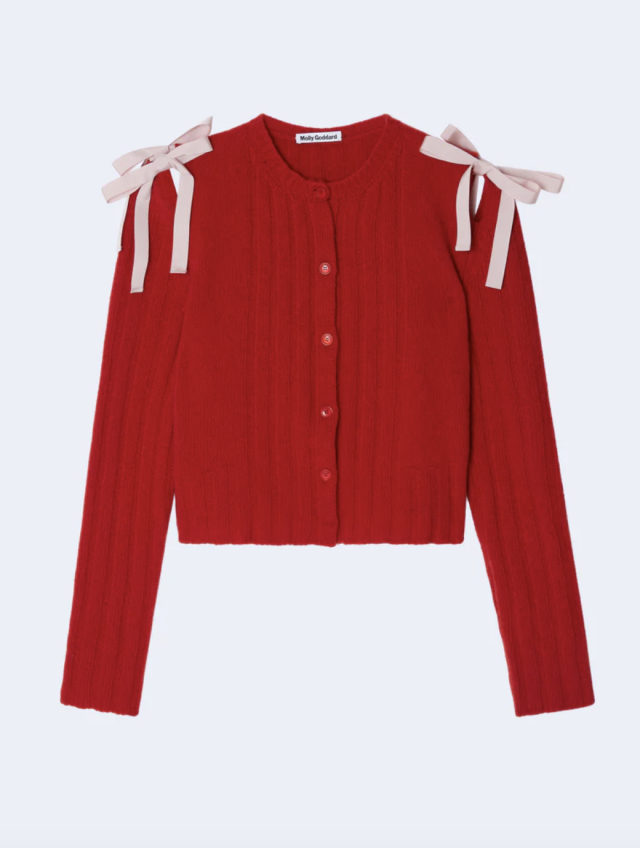 Red ribbed cardigan with ribbon bows.