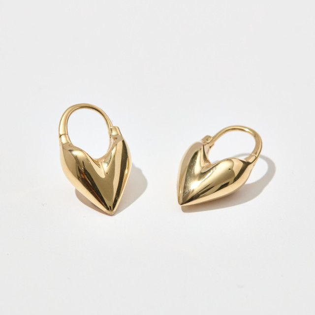 Heart-shaped gold hoop earrings.