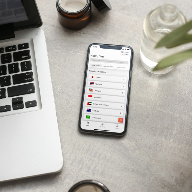 A smartphone displays a travel app interface listing 