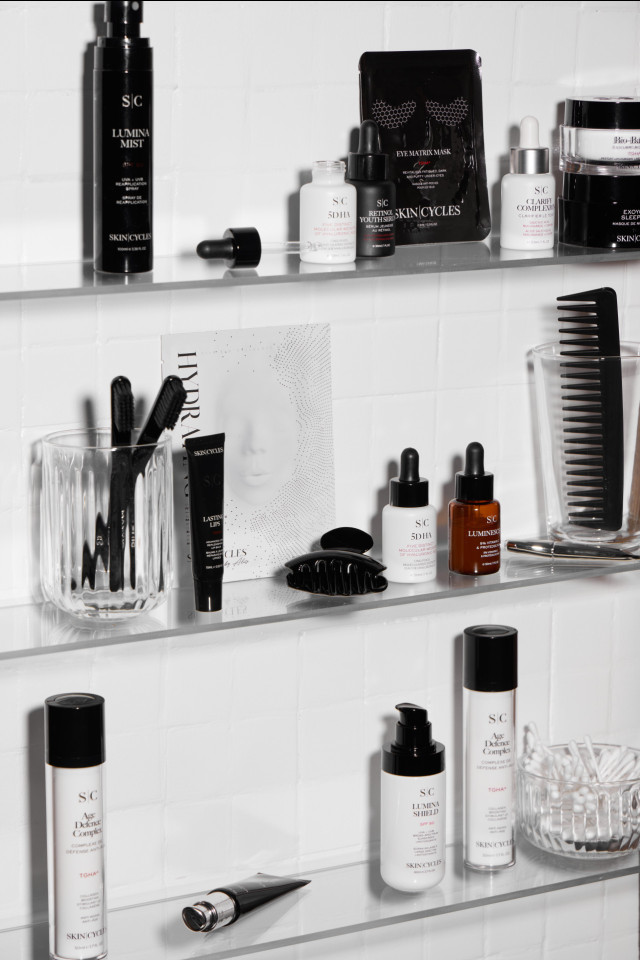 Various skincare products, including bottles and tubes labeled 