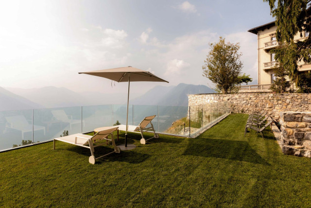 Mountaintop lawn chairs and umbrella.